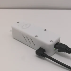 Wi-Fi Jammer Detector full kit showing white detector unit, USB wall adapter, 6ft Micro-USB cable, and 6ft Ethernet cable on white surface