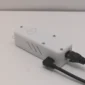 Wi-Fi Jammer Detector full kit showing white detector unit, USB wall adapter, 6ft Micro-USB cable, and 6ft Ethernet cable on white surface