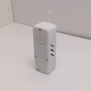 Wi-Fi Jammer Detector kit from corner angle showing detector unit, USB wall adapter, Ethernet cable, and Micro-USB cable laid out on white table